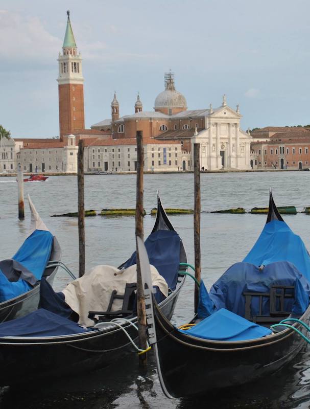 Gondolas in Venice Italy. Read why you need to include Venice on your itinerary for Europe and more tips for creating the perfect Europe itinerary! #travel #europe #venice #italy