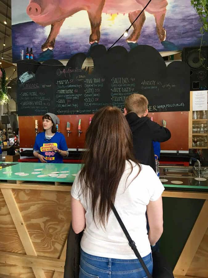 Girl waiting in line for a beer at Oedipus Brewing, a great craft brewery in Amsterdam Noord, a cool part of Amsterdam. #amsterdam #craft beer