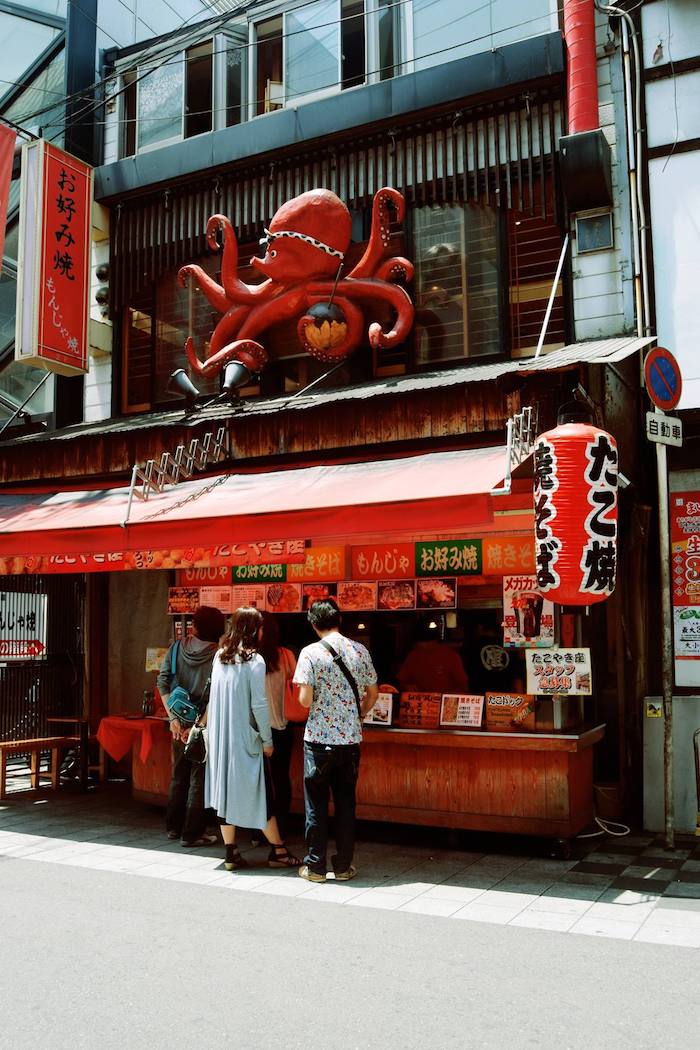 Takoyaki Stand in Osaka Japan. If you're visiting Osaka, follow this Osaka travel guide for spending two days in Osaka with helpful tips on unique things to do in Osaka and food in Osaka to try. #travel #Japan #Asia #Osaka