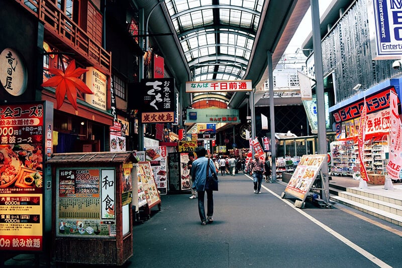 Street in Osaka. Read budget travel tips for Japan and how to save money before your trip to Japan!