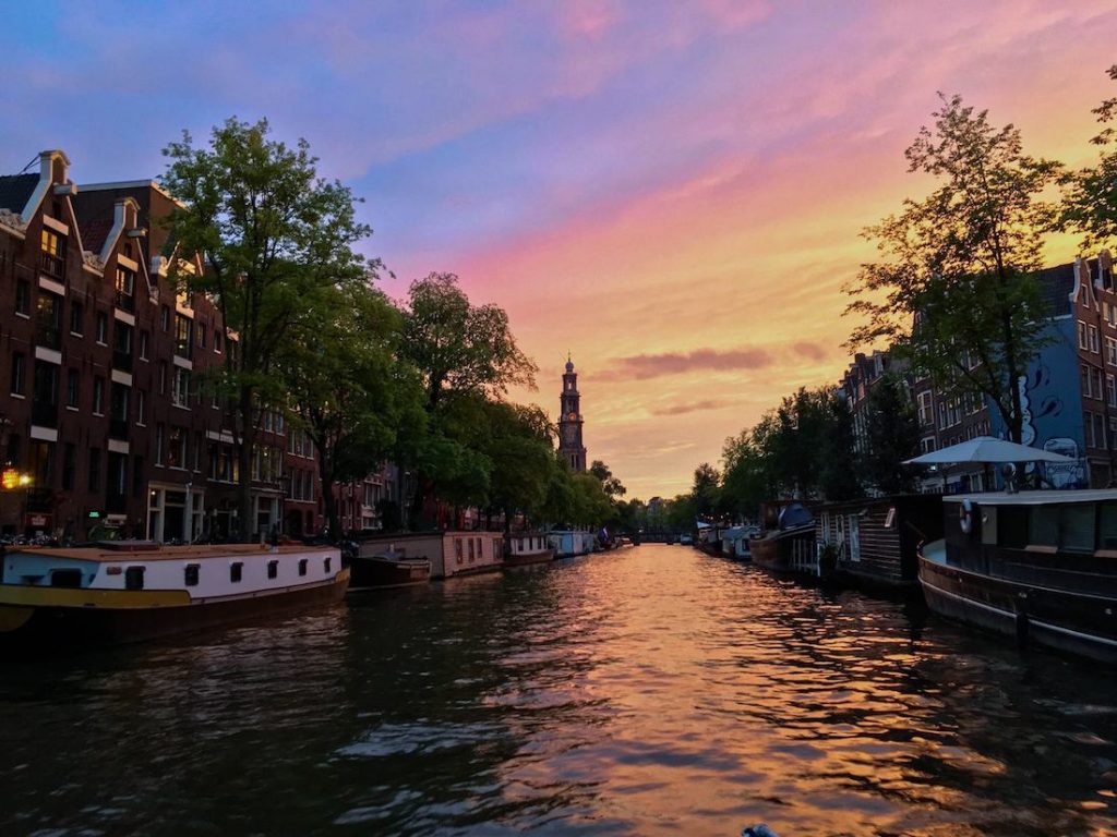 Beautiful sunset in Amsterdam, the Netherlands. Read insider tips for visiting the Netherlands written by a resident! #travel #Amsterdam #sunsets #Netherlands #holland