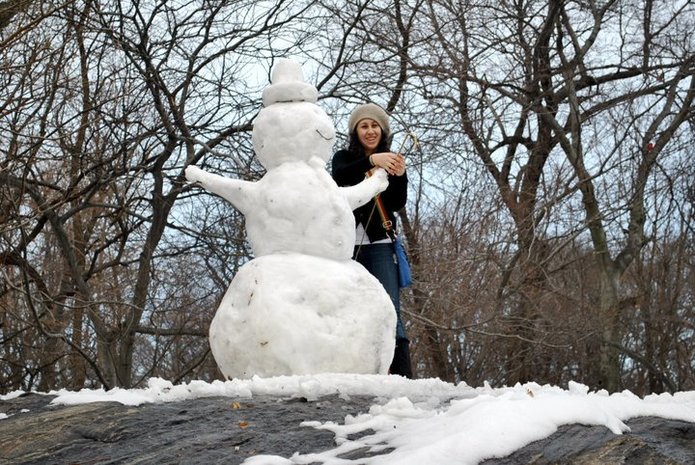 Photo of snowman in Central Park. Read about visiting New York City for the first time!