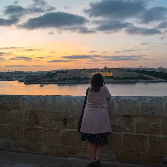 View from Valletta Malta at sunset. Read what to do in Malta during four days in Malta with the perfect Malta itinerary! #travel #malta #valletta #sunset #europe #UNESCO