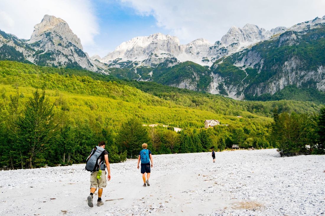 Photo of hikers in Valbona Peak National Park in Albania, one of the most beautiful places in Albania. 