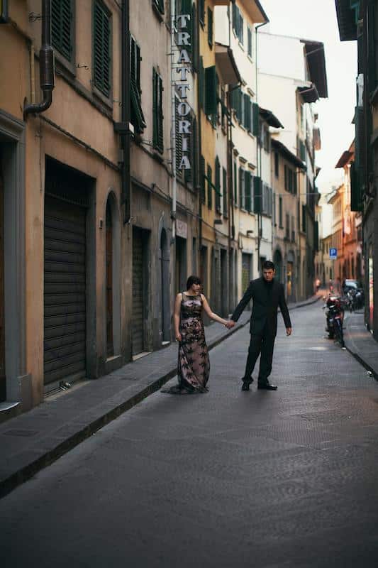 Old world charm. Couple holding hands on streets of Florence in Italy from an elopement in Italy. 