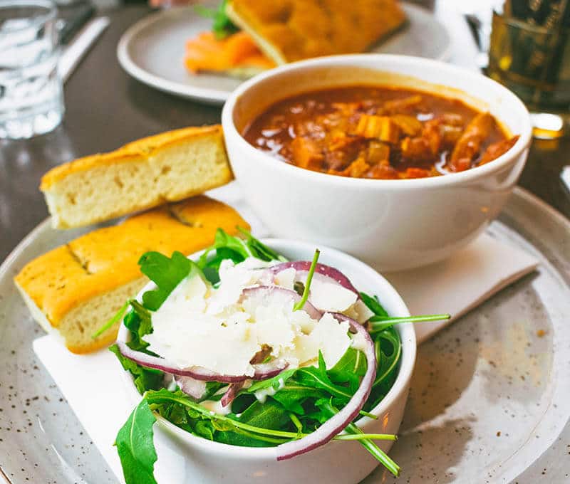 Delicious lunch with chicken, fresh bread, and a salad at Coffeelovers, a popular restaurant in Maastricht, the Netherlands