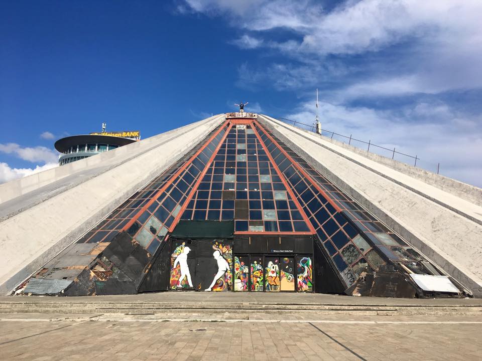 The pyramid of Tirana, one of the highlights of Tirana Albania. Read about what to do in Tirana and what to include on your Albania itinerary. #Albania #Tirana #Travel #Europe #Balkans