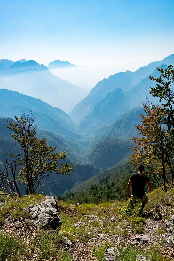 Photo of man hiking in Theth National Park in Albania. See why you should visit Albania with beautiful photos of Albania! #Albania #Travel #Balkans