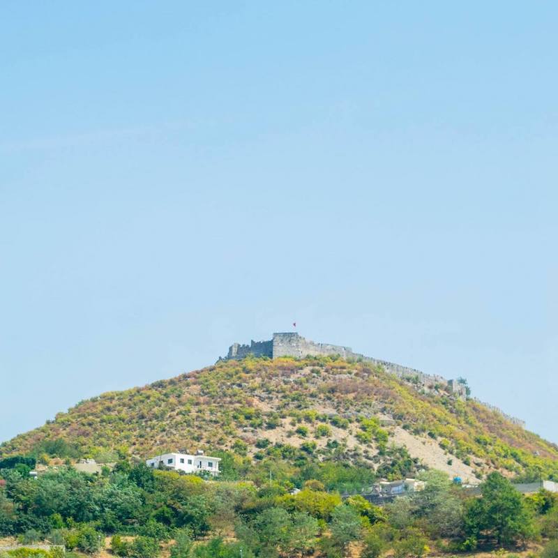 Rozafa castle in Albania. This beautiful hill-top castle is a highlight of Shkodra, one of the best cities to visit in Albania. #Travel #Albania #Balkans #castles