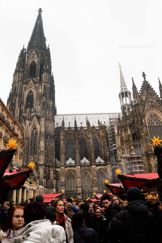 Cologne Christmas Market during the day. Read about the best things to do in Cologne in December with tips for visiting the Christmas Markets in Germany