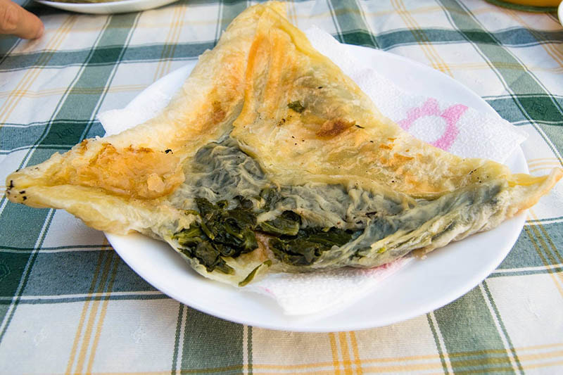 Photo of Byrek, a traditional Balkan food commonly eaten in Albania. This Albanian byrek was homemade. 