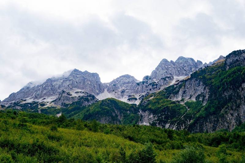 Mountains in Valbona, one of the best things to do in Albania. This mountain-side retreat is one of the highlights of Albania! #travel #Albania #Balkans #Mountains #Europe