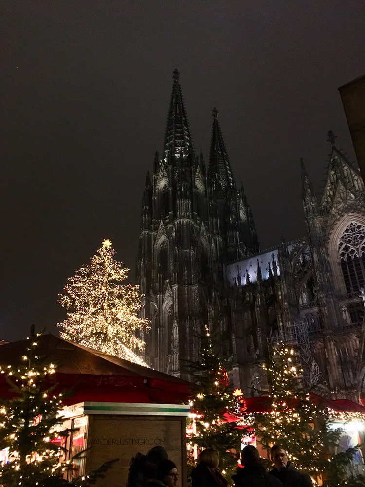 Photo of Cologne Cathedral during Christmas market. Find out the best things to do in Cologne in winter with map of Cologne Christmas Markets!
