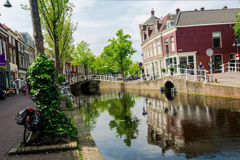 Photo of canal in Delft. See the cutest canals in Delft with this FREE self-guided walking tour of Delft with a perfect one day itinerary for Delft! #Delft #Travel
