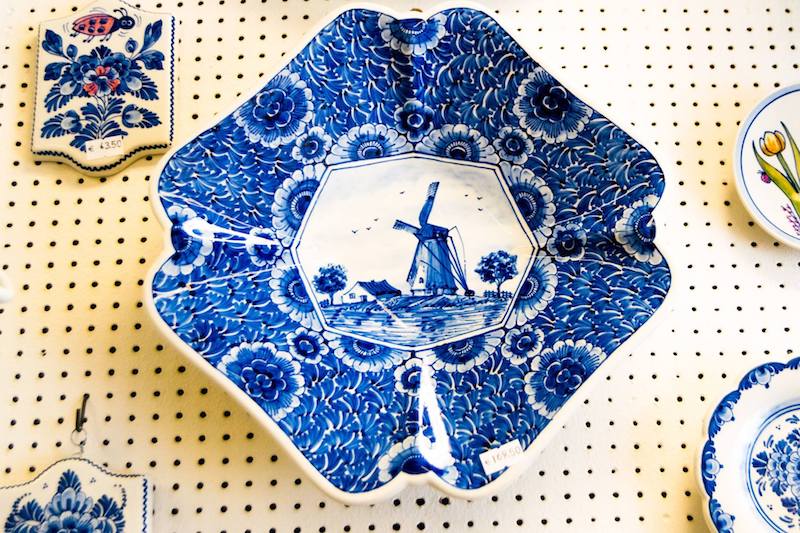Photo of delftware in Delft. When visiting Delft, be sure to stop off at the delftware stores in Grote Markt. Follow this FREE walking tour of Delft to get more insider tips on what to do in Delft and where to eat in Delft! #Delft