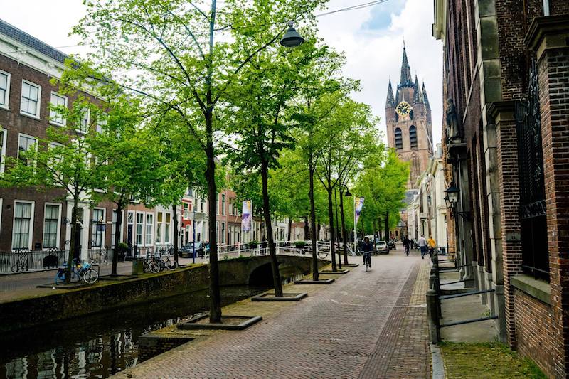 Photo of Oude Delft canal in Delft. This beautiful canal is a must-see in Delft. Follow this free Delft one day itinerary for the best things to do in Delft. #Netherlands #Delft #Travel