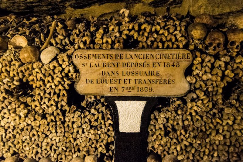 Bones in the Paris Catacombs, one of the best things to do in Paris during your trip to Paris. Read insider tips for the perfect Paris itinerary. #travel #paris #europe #france