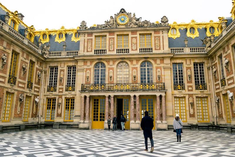 Exterior of Versailles. Read how to avoid the crowds at Versailles and the best month to visit Versailles! #travel #versailles #paris #france