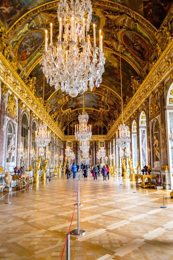 Hall of Mirrors at Versailles. Read Versailles travel tips on the best month to visit Versailles and how to avoid the crowds at Versailles! #travel #france #paris #versailles