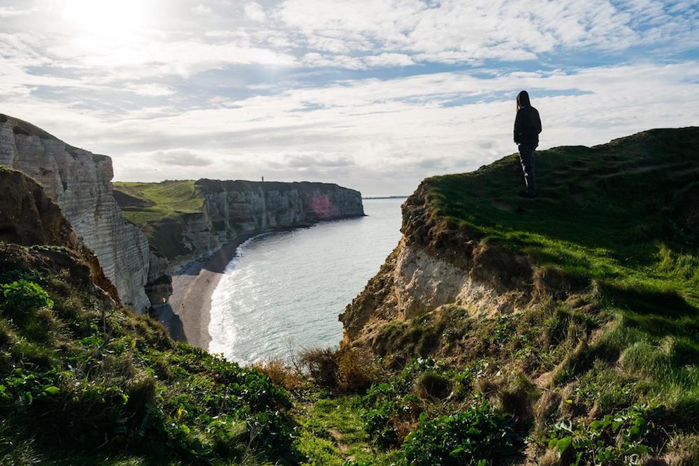 Cliffs of Étretat, one of the most famous attractions in Normandy France. Read what to do in Normandy on a long weekend trip from Paris! #normandy #france #travel #Étretat