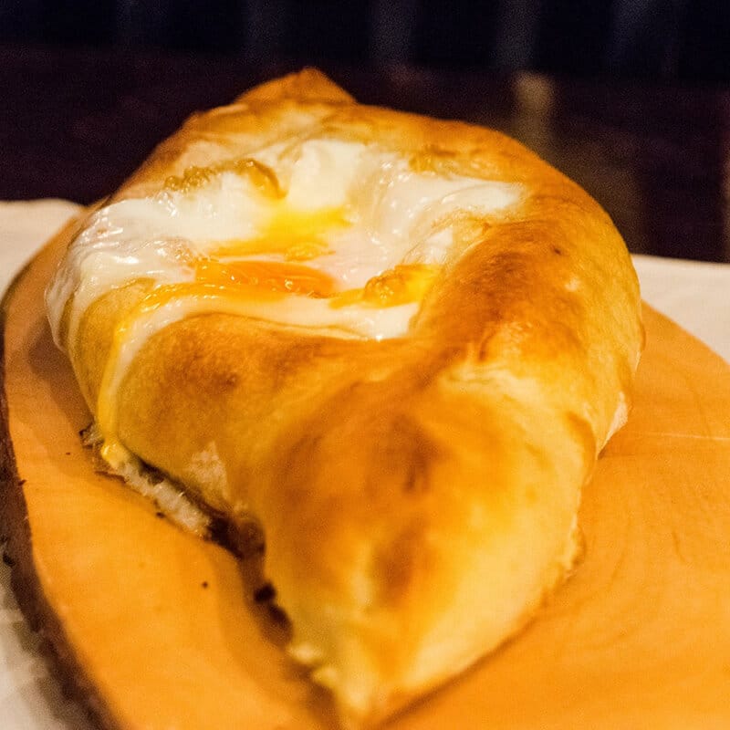 Delicious khachapuri at Suhumi, a Georgian restaurant in the Hague.  If you're looking for a romantic meal in the Hague, this is where to eat! #travel #food #georgian #holland #Netherlands
