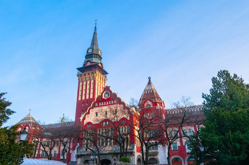 The beautiful art nouveau building that is city hall in Subotica Serbia. Read why you need to visit Subotica, one of the cutest cities in Serbia! #travel #balkans #serbia #subotica #europe #architecture #artnouveau