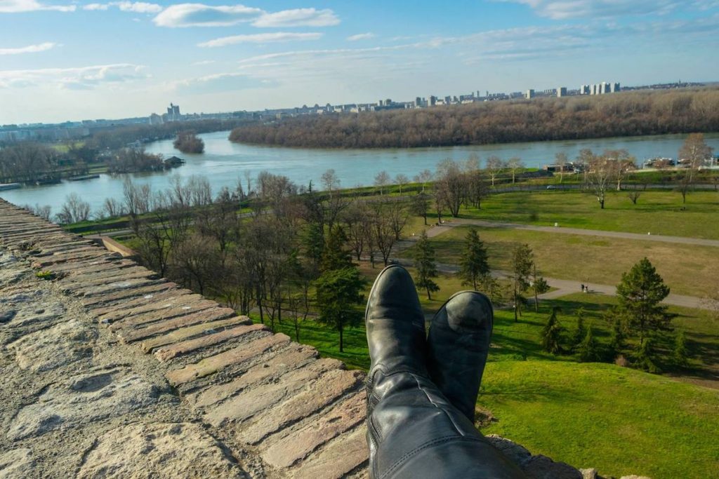Solo female traveler putting her feet up near the fortress in Serbia. #travel #serbia