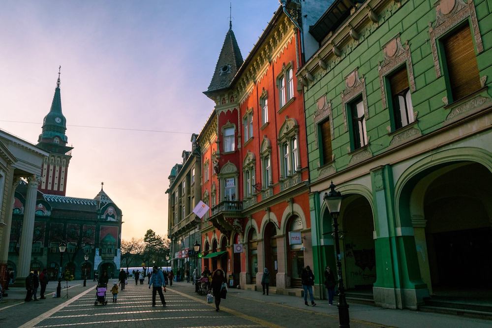 Sunset over City Hall in Subotica Serbia. Read why you must visit this art nouveau architecture gem, one of the most beautiful cities in Serbia! #travel #serbia #balkans #subotica #europe #artnouveau 