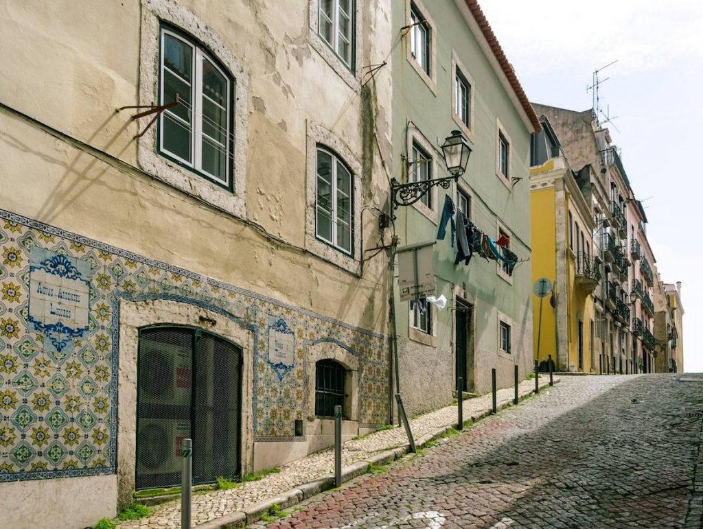 Beautiful streets of Lisbon Portugal. Read how to get a free Lisbon Layover with TAP Portugal Airlines in this review of flying with TAP Portugal. #travel #Portugal #airlines