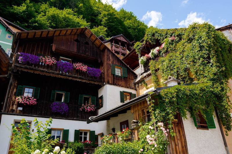 Beautiful timber building in Hallstatt, Austria with a view looking up towards the mountain.
