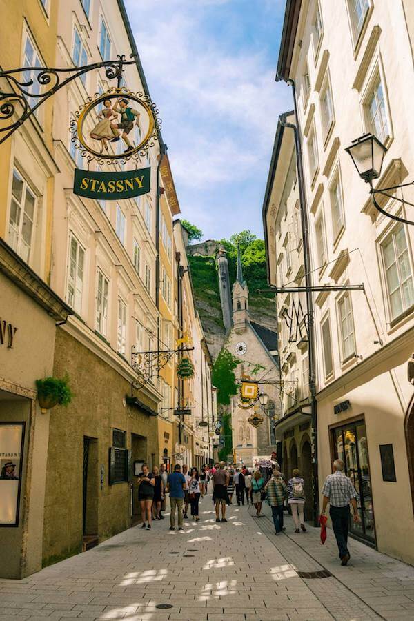 Beautiful shopping street with traditional signs in Salzburg, Austria