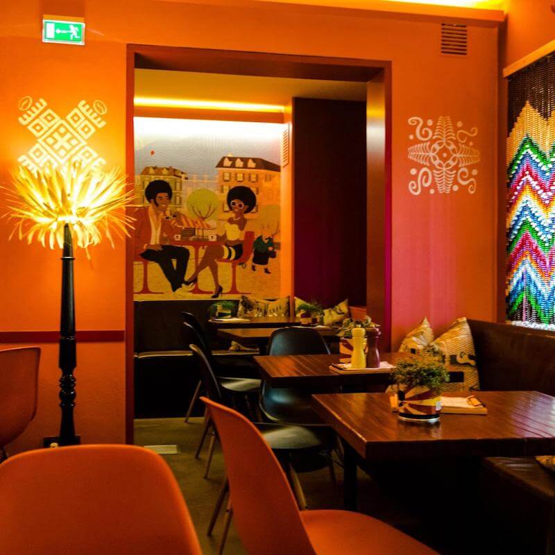 Photo of Afrocafe, a colorful modern coffee house in Salzburg, Austria.