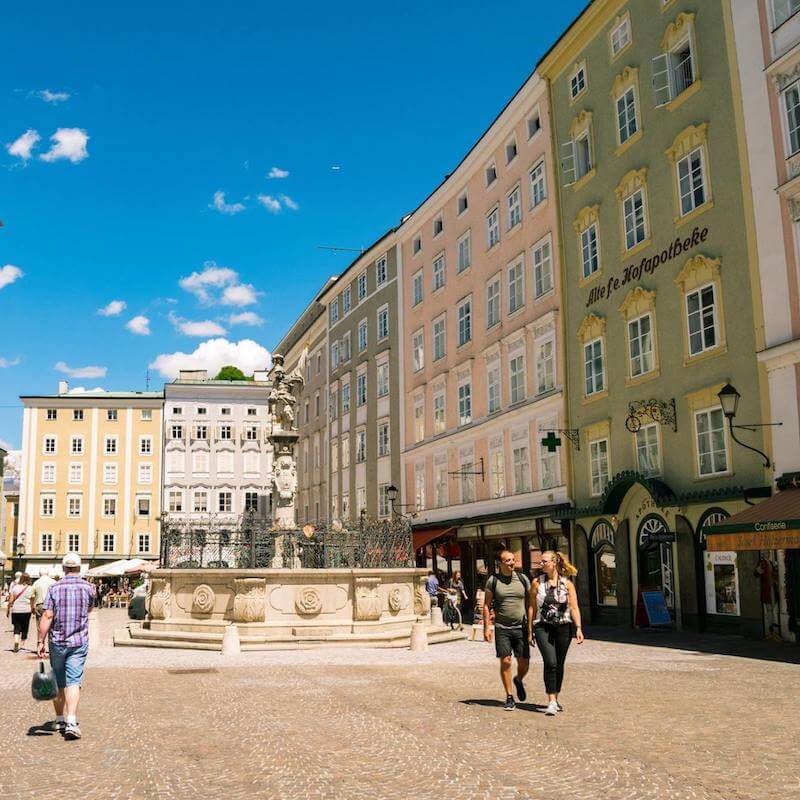 Pastel colored buildings in the old historic center of Salzburg, Austria.