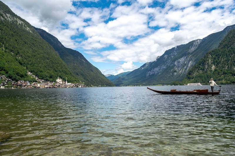 Traditional boat along the Hallstätter See with a view of Hallstatt, Austria.