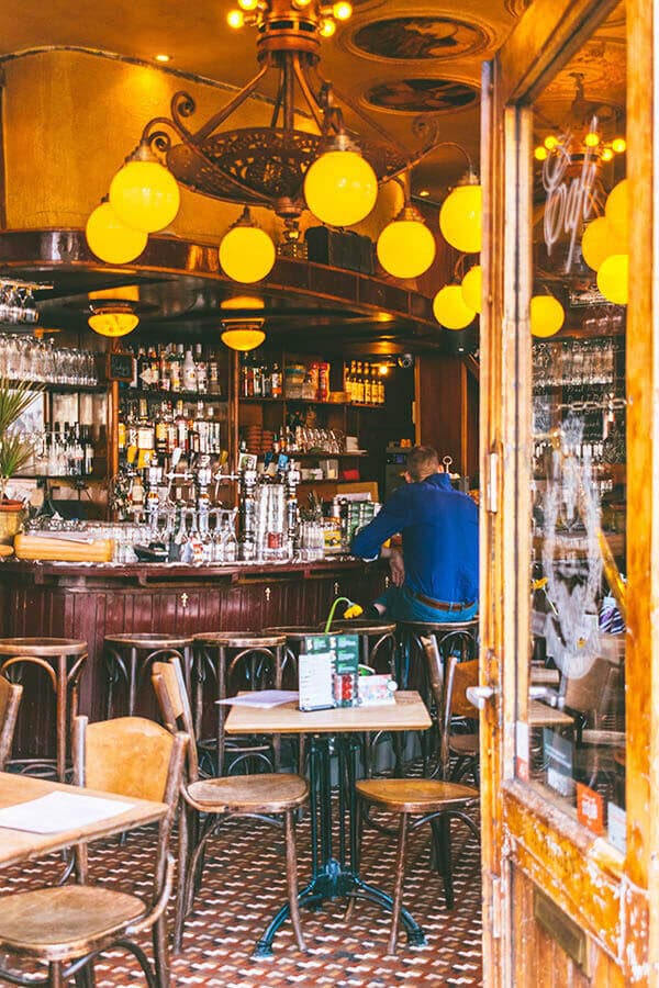 Interior of a cozy brown bar in the Jordaan neighborhood of Amsterdam.  You must experience a brown bar (a classic Dutch bar!) while in Amsterdam! #amsterdam #holland #netherlands #nederland