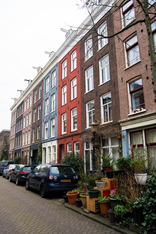 Beautiful houses of De Pijp, one of the most instagrammable places in Amsterdam. Read insider tips for the best places to take photos in Amsterdam! #amsterdam #travel #photography