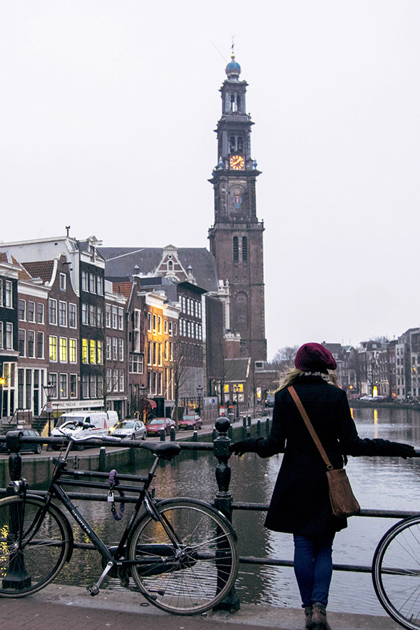 Girl in Amsterdam in winter. Winter is the perfect time to visit Amsterdam as there are many seasonal things to do in Amsterdam! #amsterdam #netherlands