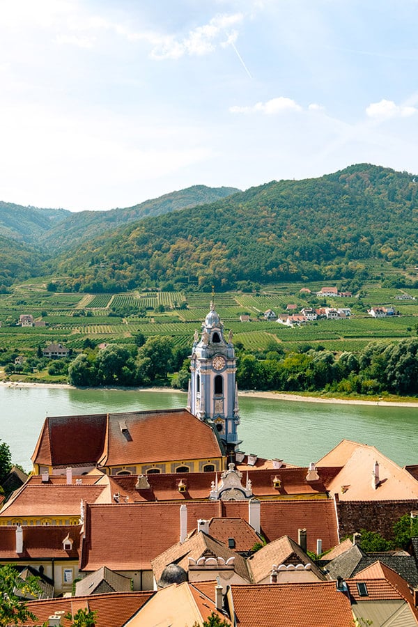 The beautiful blue tower of Dürnstein, Austria. This iconic sight of Dürnstein is one of the reasons to visit this fairytale town in Austria, just a day trip from Vienna in the heart of the Wachau region. #travel #vienna #austria #europe