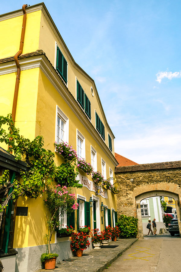 Beautiful colorful building in Dürnstein, Austria.  The historic center of Dürnstein is worth enjoying on a day trip! #travel #austria #Dürnstein #europe