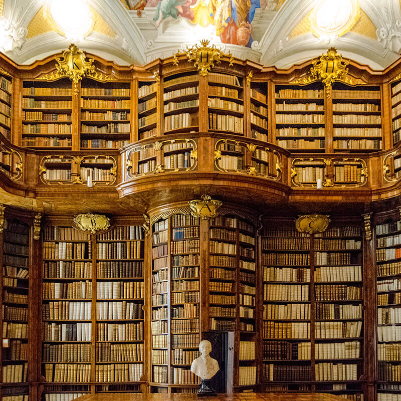 Beautiful library at St. Florian, one of the abbeys in Austria that you can visit on a budget. #travel #austria #libraries #litgeek