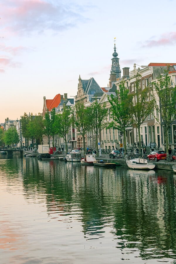 Beautiful sunset in Amsterdam; Walking along the canals is one of the best activities for couples in Amsterdam. #amsterdam #holland #netherlands