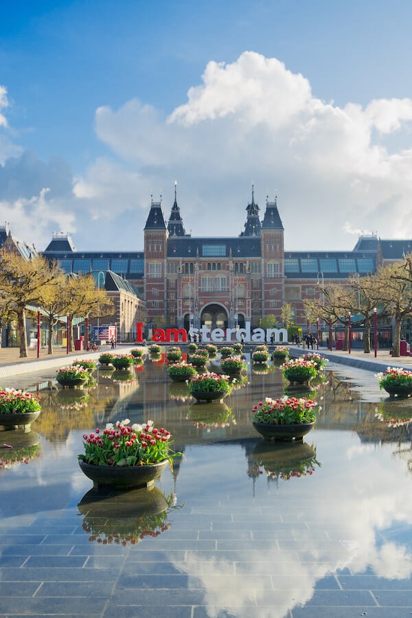 View of the Rijksmuseum, one of the best museums in Amsterdam to visit. Read tips for skipping the line at the Rijksmuseum and what museums in Amsterdam to visit! #travel #Amsterdam #holland #dutch #netherlands