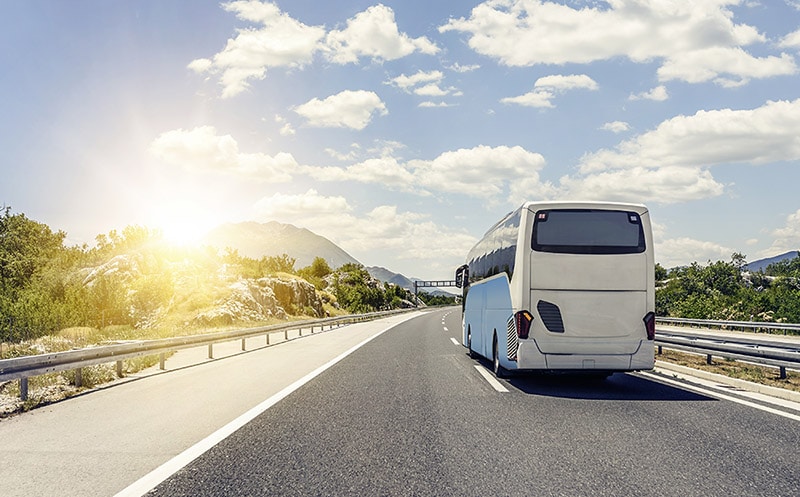 Bus traveling along highway in the United States. Must-know tips if you're considering traveling by bus in the US!