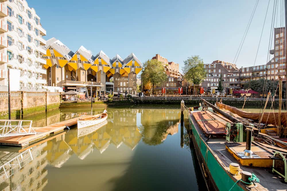 The famous cube houses of Rotterdam taken from the old harbor of Rotterdam. Touring the cube houses are one of the best things to do in Rotterdam. #travel #rottterdam