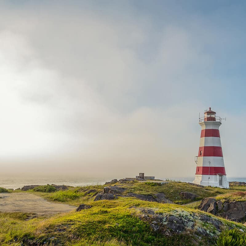 Lighthouse on Brier Island, a great stop off on a Nova Scotia road trip!  From here, you can see great views of the Bay of Fundy.