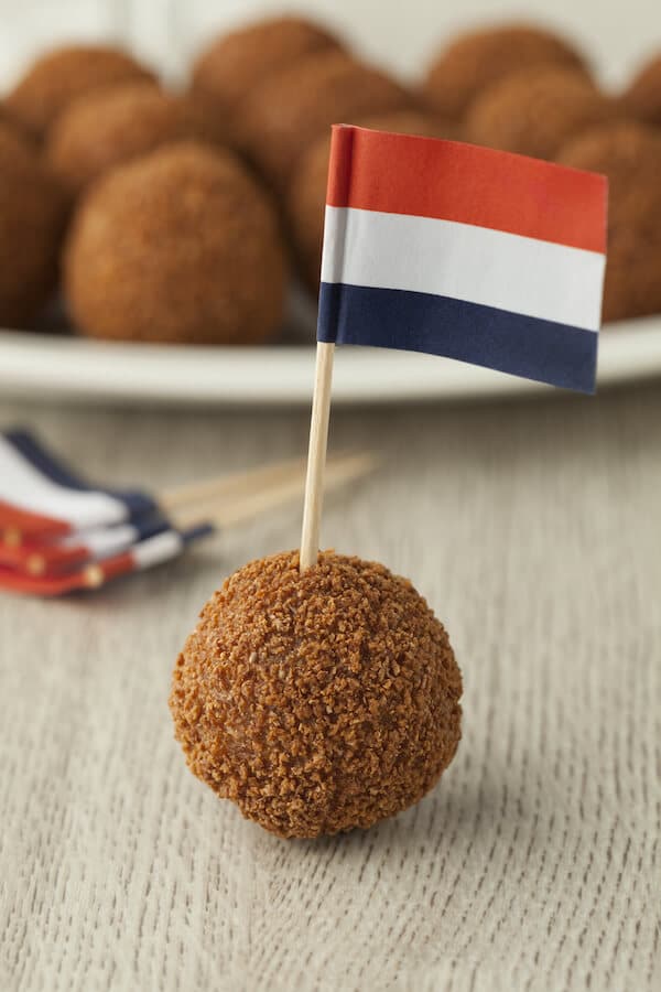 Bitterballen, a Dutch food that you must try in Amsterdam, the Netherlands. If you're wondering what to eat in Amsterdam, you must read this list! #travel #Netherlands #Holland #Amsterdam 