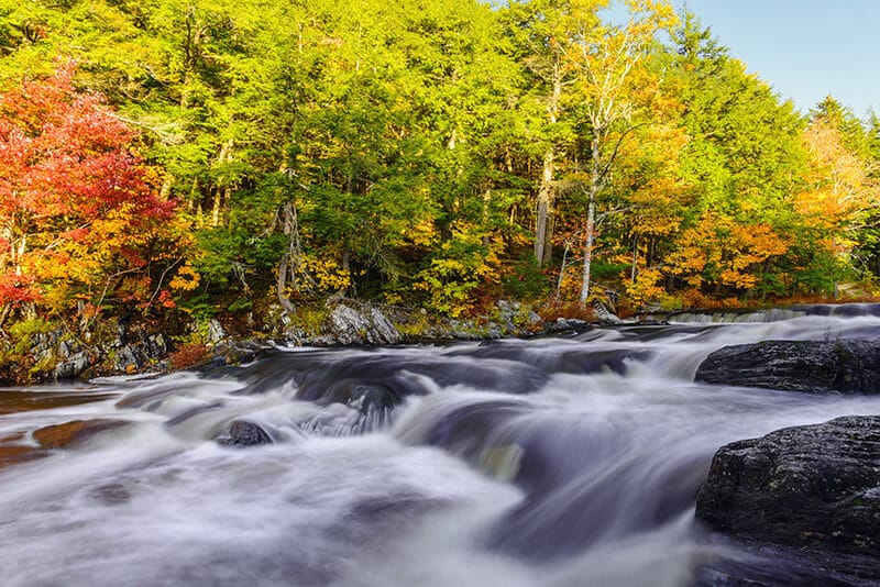 Beautiful photo of a waterfall in Kejimkujik National Park on Nova Scotia, Canada.  Visiting this stunning national park is one of the best things to do in Nova Scotia. 