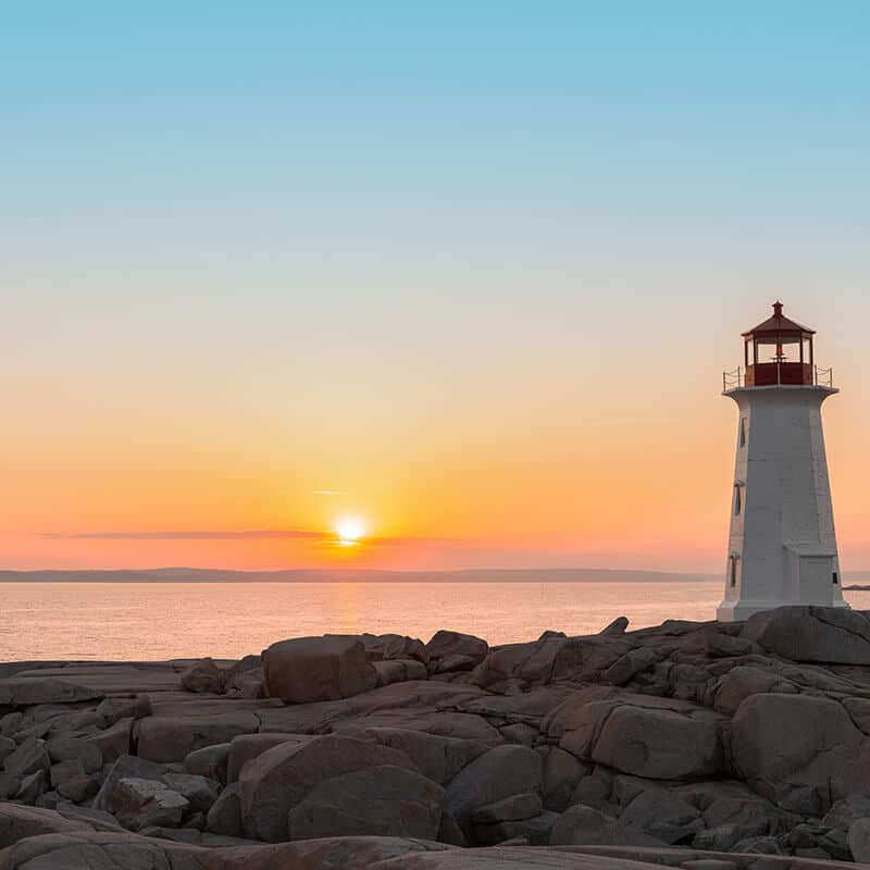 Beautiful sunset at Peggy's Cove lighthouse.   This famous lighthouse in Nova Scotia was once put on a Canada stamp! #canada #travel