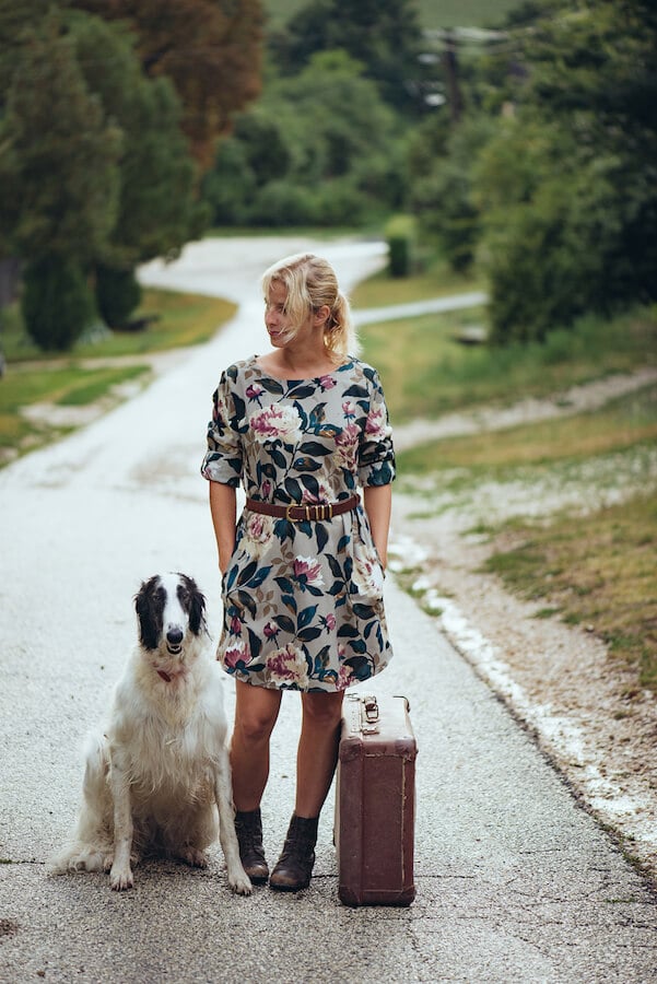 Woman traveling with her dog. Traveling with your dog doesn't need to be so complicated! #travel #pets #dogs