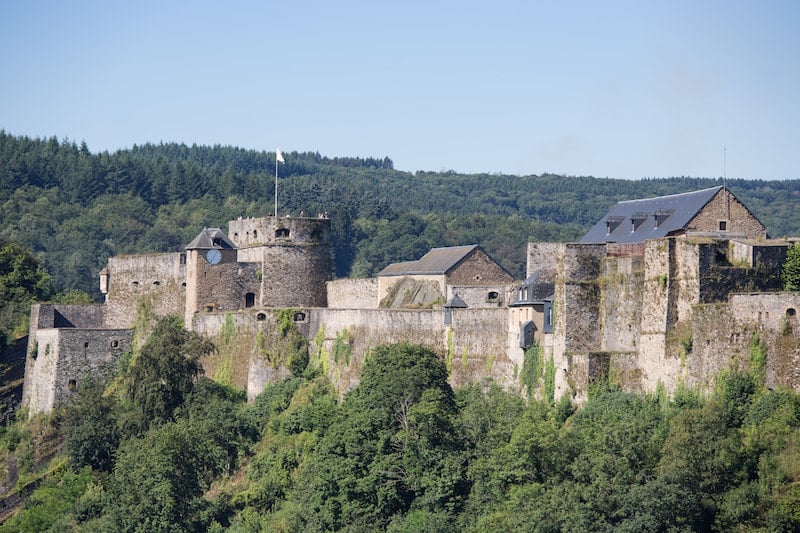 Photo of castle in Bouillon. See why you should visit Wallonia to see the most beautiful cities in Belgium by visiting Wallonia! 